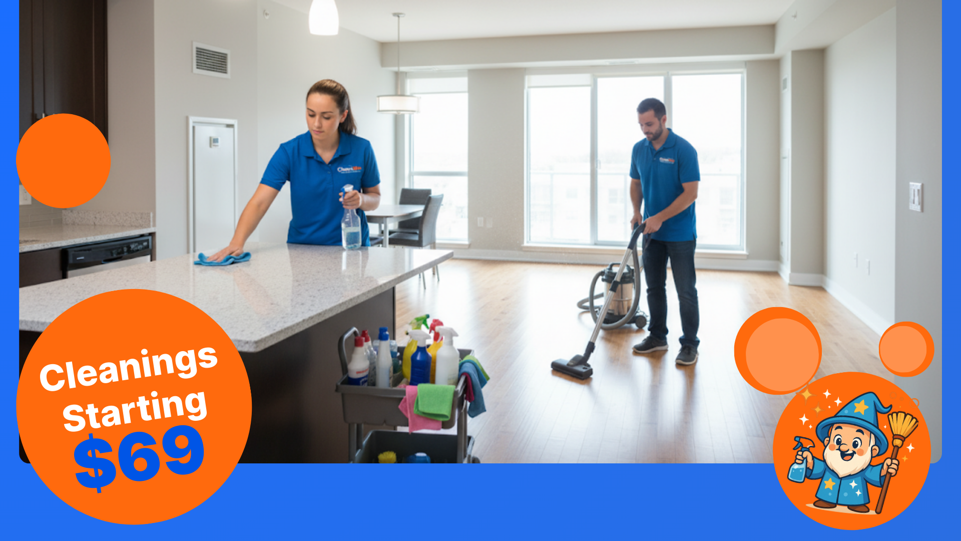 Two professional female cleaners in a modern kitchen, one dusting and the other wiping counters.