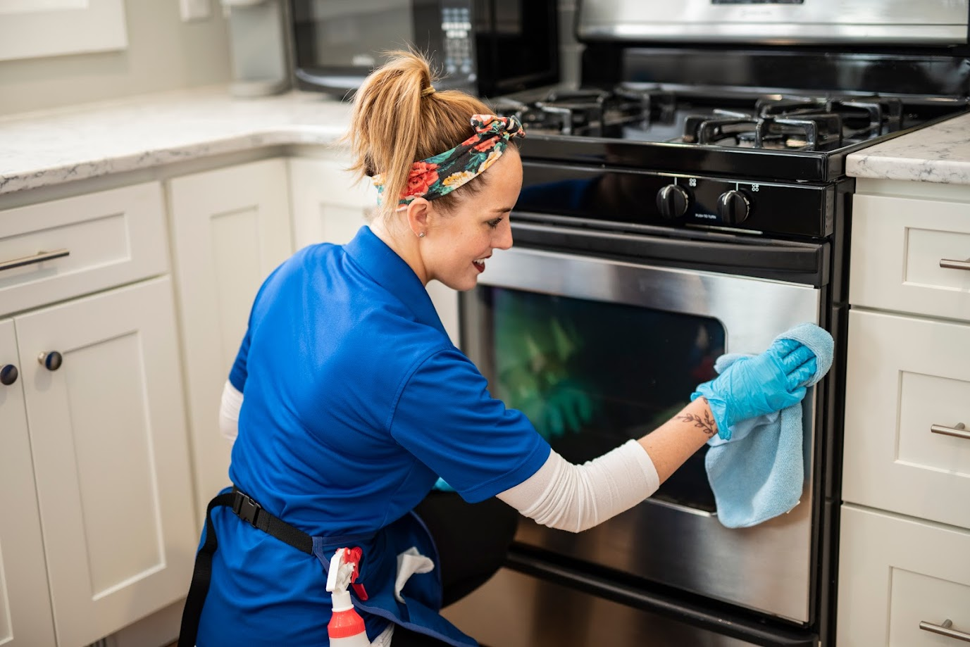 Professional cleaner deep cleaning a kitchen countertop